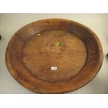 A large circular wooden shallow bowl diameter 25 1/2"