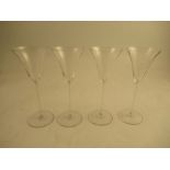 A set of 4 Lalique clear glass slender stem wine glasses , inscribed R Lalique France to the base