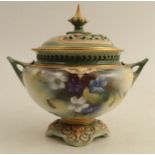 A Royal Worcester covered vase, decorated with flowers by J Lander, shape number H165, height 5.