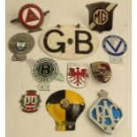 A collection of eleven assorted metal and enamel car bumper badges. to include Bentley Drivers club,