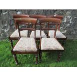 A set of five Regency style mahogany bar backed dining chairs