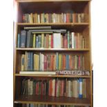 A large collection of books to include Dickens, paper backs etc