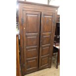 An oak two door hall cupboard, with fielded doors and sides, width 38ins, depth 15ins, height 70.