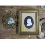 A framed Wedgwood silhouette plaque, of Sir Winston Churchill by Arnold Machin, together with a