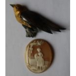 An unmounted shell cameo, carved with a girl by a well, diameter 1.75ins, together with a moulded