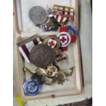 A quantity of assorted badges, medals and medallions to include British Red Cross