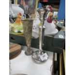 A loaded hallmarked silver candle stick, height 8ins together with a hallmarked silver spill vase