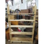 A pine set of shelves width 48ins, height 79ins