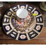 A Royal Crown Derby Imari pattern trio and plate