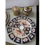 Two Royal Crown Derby covered pots and a plate, all decorated in the Imari pattern - There is a chip