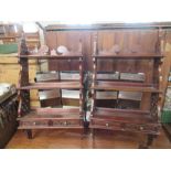 A pair of mahogany wall shelves, with pierced shaped sides, fitted with two small drawers, height