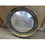 A Regency design circular concave mirror, with gilt frame with faults, diameter including frame