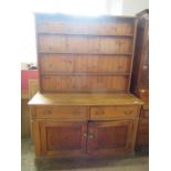 A pine dresser, with plate rack width 60ins, height 84ins, depth 23ins
