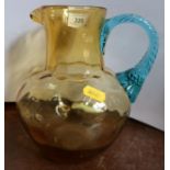 A Victorian Nailsea style  glass jug, with blue handle