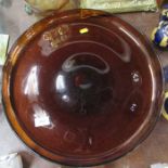 A large circular amber glass shallow bowl, diameter 17.5ins