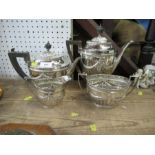 A silver four piece tea set, with ribbed lower body and ribbon swag decoration, Sheffield 1901,
