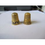 Two gold coloured thimbles, both unmarked, one with enamel and set with pearls, af, the other with