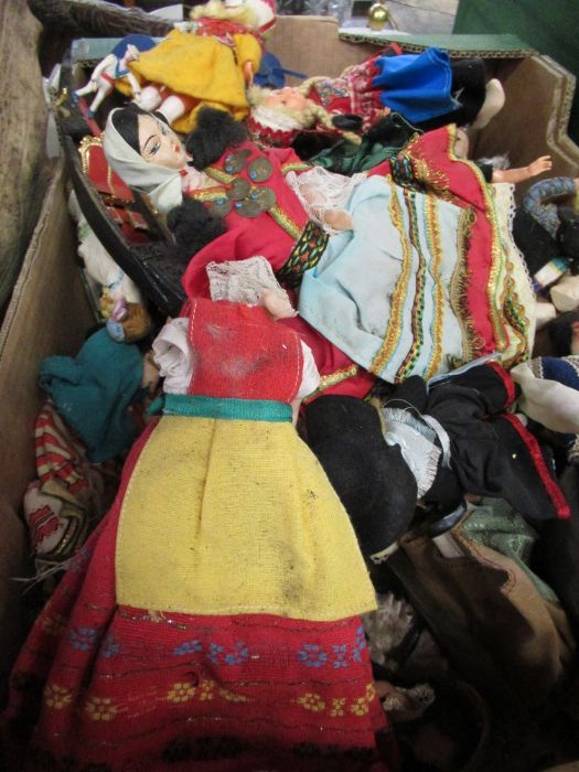 A box of assorted dolls tourist examples