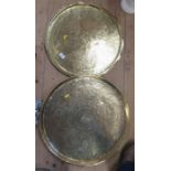 Two Eastern brass circular trays, with engraved decoration