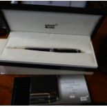 A boxed Mont Blanc ball point pen, together with a boxed Balmain two pen set and a single Balmain