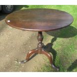 An oak tripod table, diameter 31ins, height 27ins