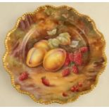 A Royal Worcester cabinet plate, decorated with fruit to a mossy background by H H Price, with