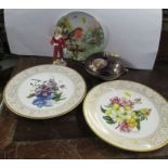 A Royal Worcester model, Parakeet Boy, together with a covered pot and three wall plates to