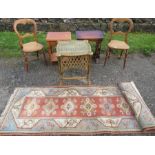 A pair of bedroom chairs, nest of tables, occasional table, wicker table and a rug.