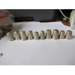 Ten hallmarked silver thimbles, to include ones by Charles Horner