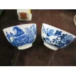 Two 18th century Worcester tea bowls, decorated in the Fence pattern and the Fisherman and Cormorant