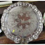 A silver plated circular tray, with engraved decoration, diameter 18.5ins