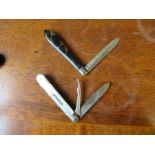 Two Antique folding pocket knives, one with mother of pearl handle and two silver blades, the
