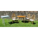 An Ercol style kitchen table and four stick back chairs, together with a kitchen extending table