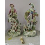 A pair of 19th century porcelain figures, of a woman with flowers gathered in her apron and a man