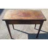 A 19th century mahogany fold over tea table, with rectangular top, fitted with a frieze drawer,