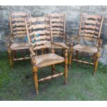 A set of four ladder back armchairs, with rush seats