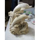 A marble model, of dolphins