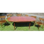 A G Plan extending dining table, and six upholstered chairs, open length 82ins, closed 64ins,