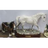 A Royal Doulton model, Desert Orchid, on a wooden base, together with a Beswick bay shire horse -