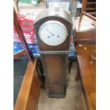 An oak cased grandmothers clock