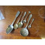A collection of silver and other spoons