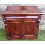 A mahogany chiffonier, fitted with a frieze drawer over a pair of cupboard doors, to a plinth