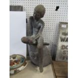 W Abolson??, pottery model of a seated figure, height 19.5ins