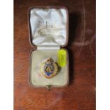 A gold and enamel Royal Engineers badge, stamped 14ct, weight 7.6g