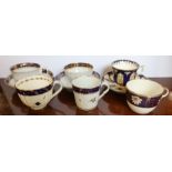 A collection of 19th century English porcelain cups and saucers, all decorated in blue and gold