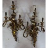 A pair of late 19th century/early 20th century gilt bronze three branch wall lights, 65cm x 40cm,