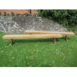 A pair of pine benches, length 98ins, depth 10ins, height 17ins