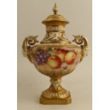 A Royal Worcester covered pedestal vase, painted all round with fruit to a mossy ground by