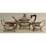 A Walker & Hall silver three piece tea set, raised on scroll legs, Sheffield 1932, weight 39oz all