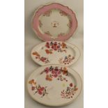 A 19th century porcelain meat plate, with crest to the center and pink border with shaped edge,